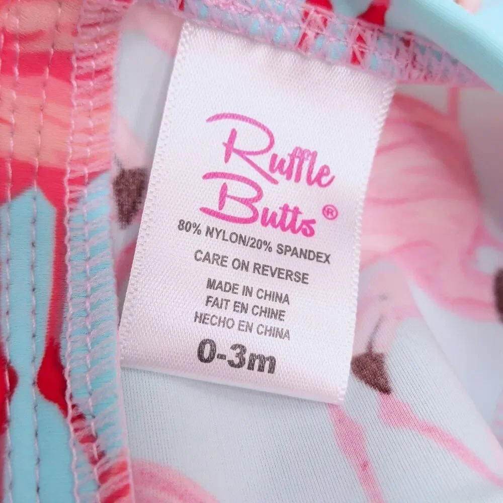 RUFFLEBUTTS Tropical Flamingo Print One-Piece 0-3m Baby Rashguard Ruffles